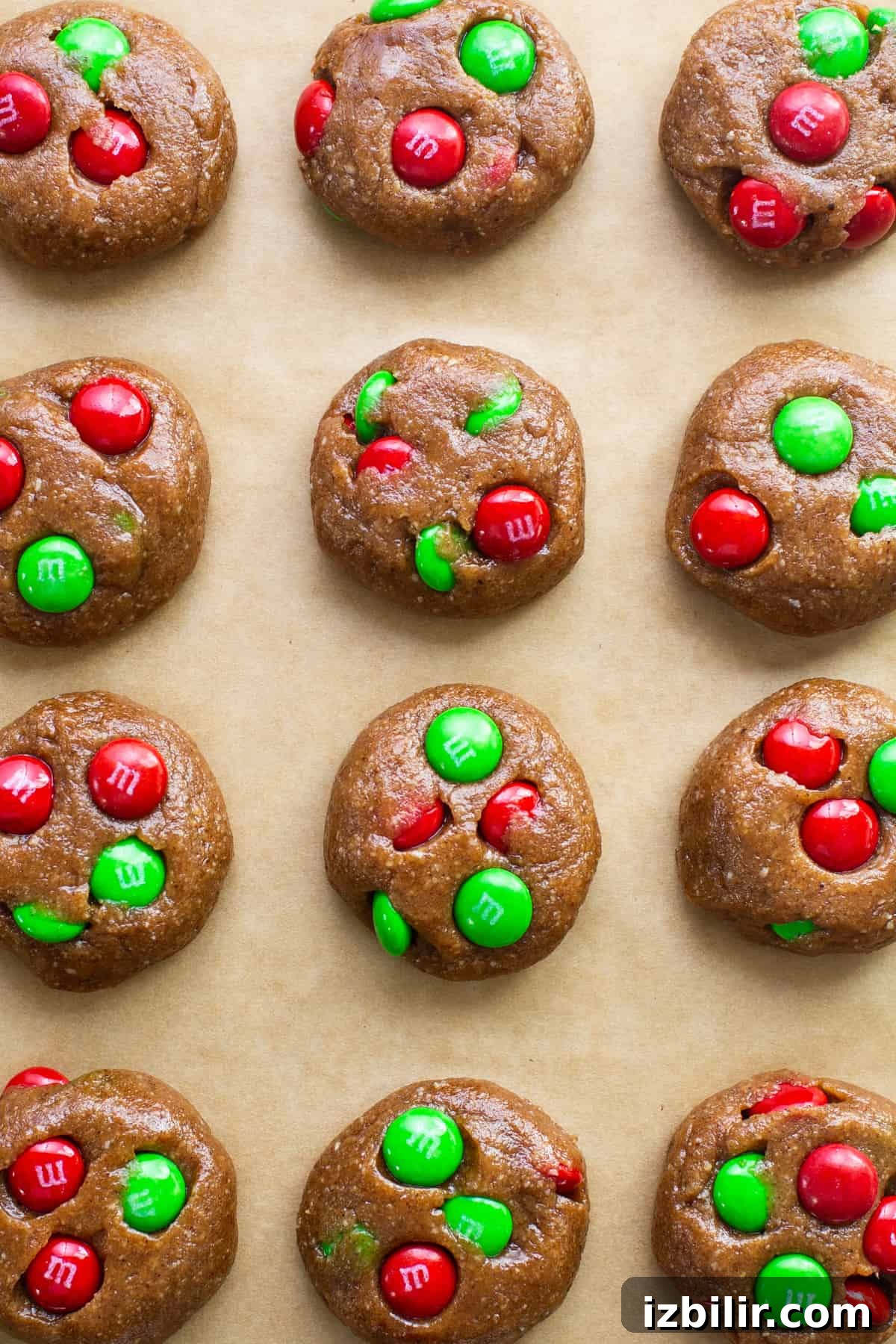 M & m cookies on a baking sheet with green and red m & m's.
