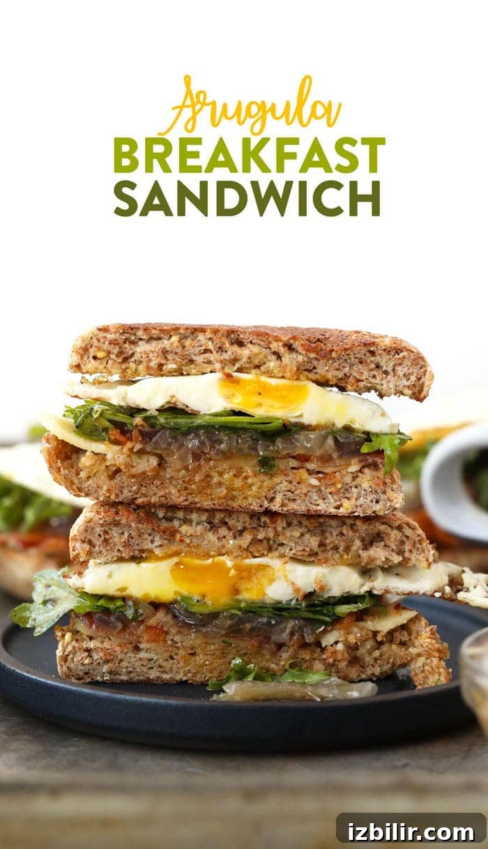 Start the morning off right with this Arugula Breakfast Sandwich with Caramelized Onions! Whole grain English muffin, peppery arugula, and caramelized onions.