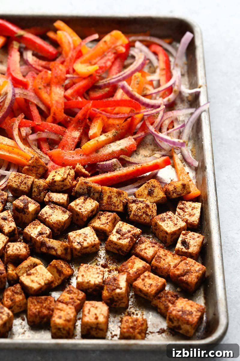Tofu and roasted peppers for Sheet Pan Burrito Bowls