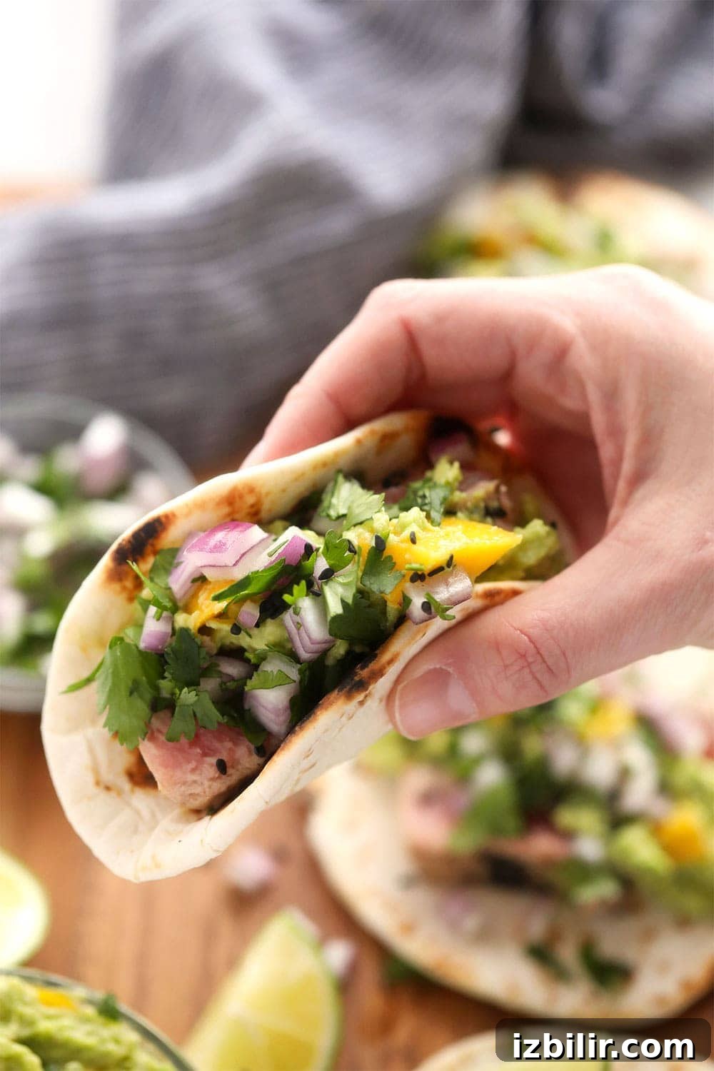 Holding an ahi tuna taco Holding an ahi tuna taco