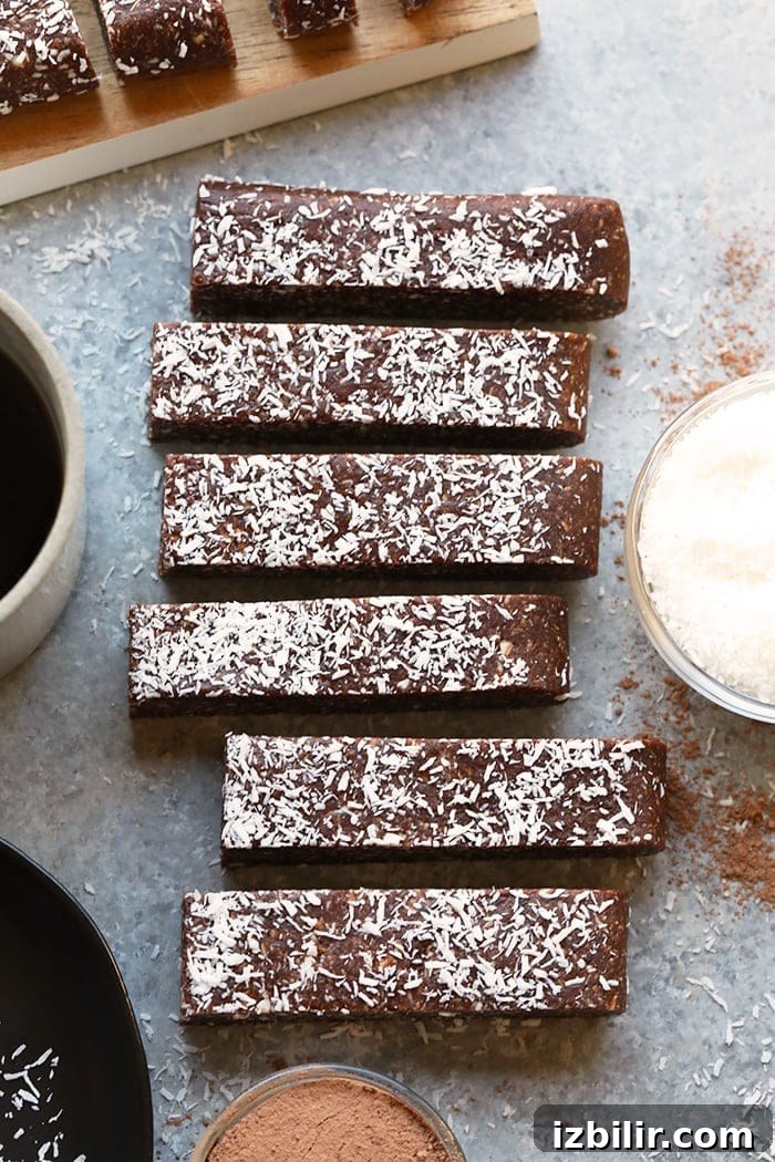 No-Bake Chocolate Coconut Energy Bars Recipe 5 Stacked chocolate coconut date bars ready to eat