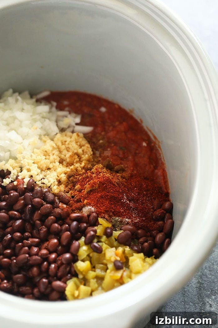 This crock pot black bean soup is an easy and delicious vegetarian soup that is packed with flavor! crock pot black bean soup in a slow cooker