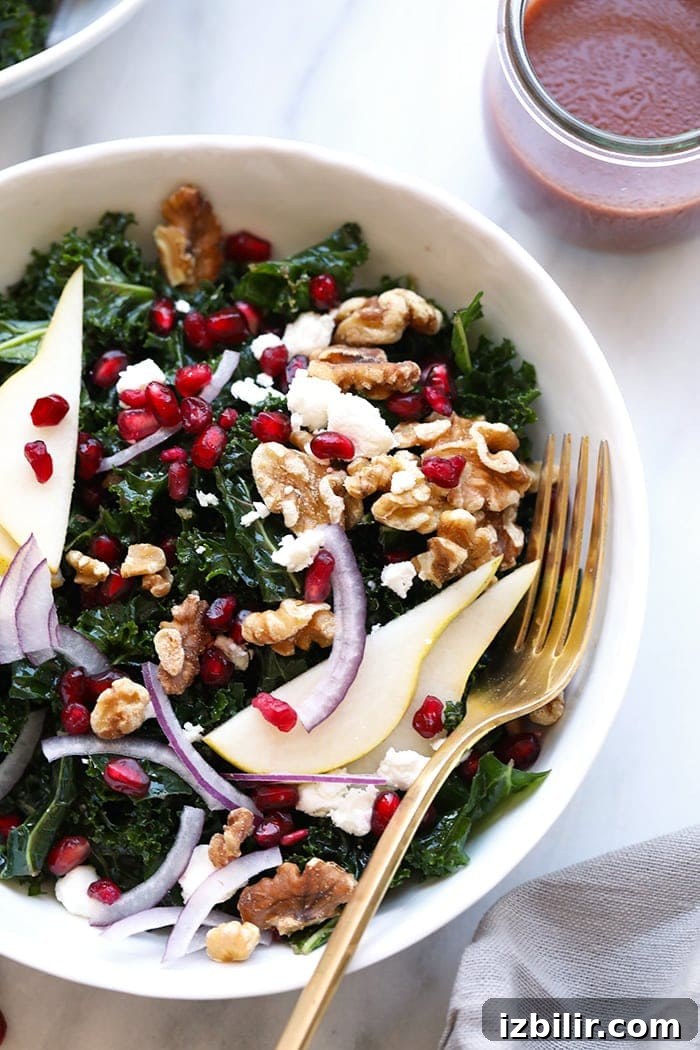 Kale and pomegranate salad in a bowl bowl of kale salad
