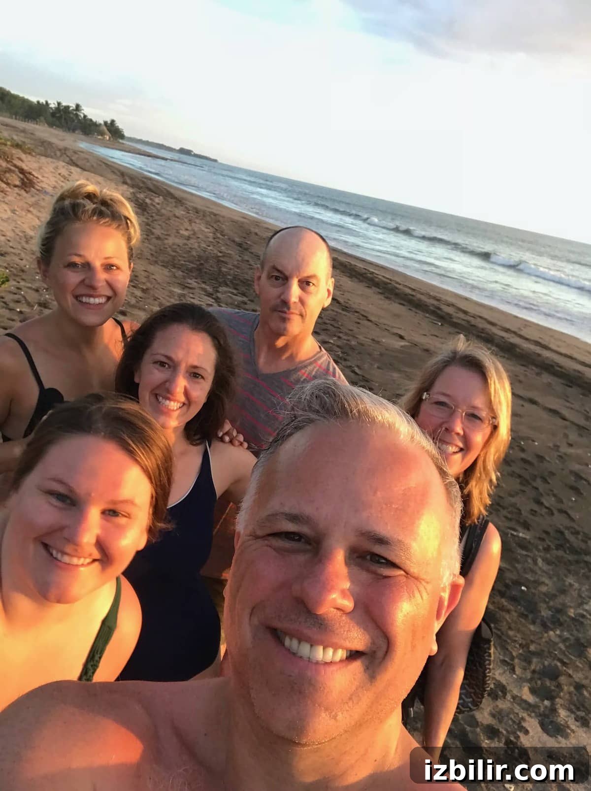 Head to Nicaragua for a Yoga retreat for your people! People takin a selfie on the beach.