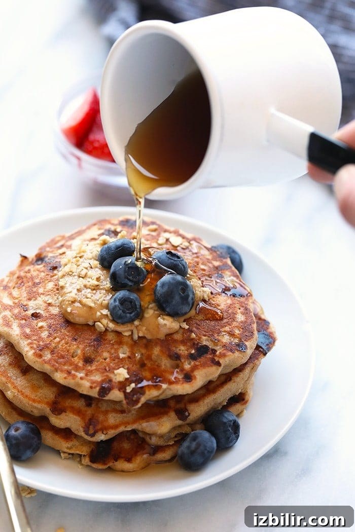 Fluffy Cottage Cheese Pancakes Recipe 6 Maple syrup pouring onto pancakes