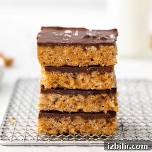 Stacked scotcheroos on a plate.