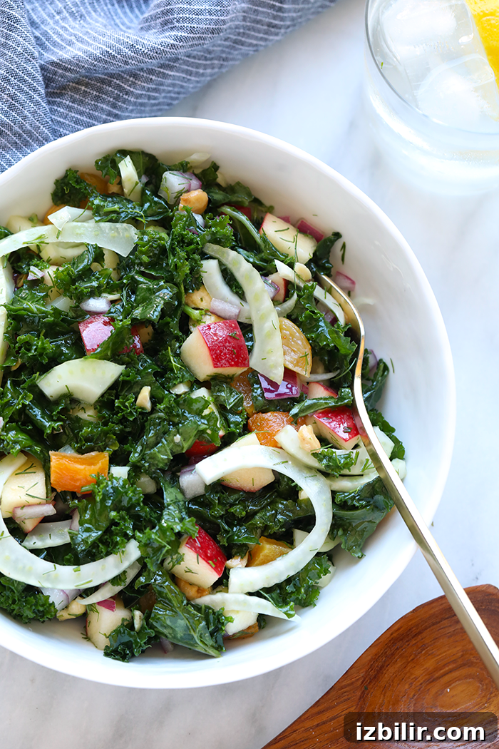Massaged fennel and kale salad with lemon vinaigrette Finished kale salad in a serving bowl.