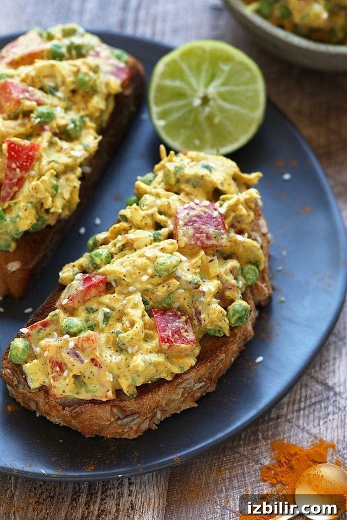 Curried Chicken Salad Recipe 2 Curry chicken salad on a piece of toast