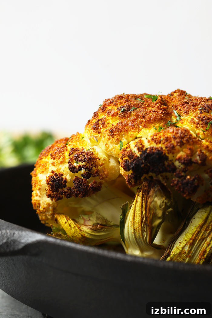 finished roasted cauliflower in a cast iron pan