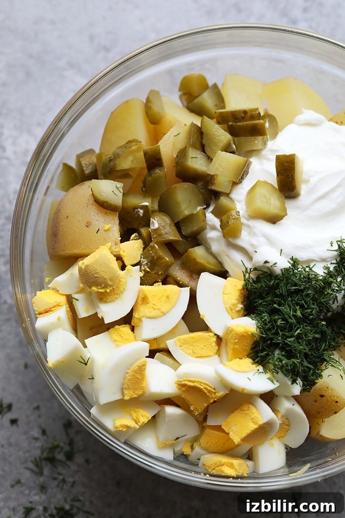 Ingredients for the potato salad in a bowl.