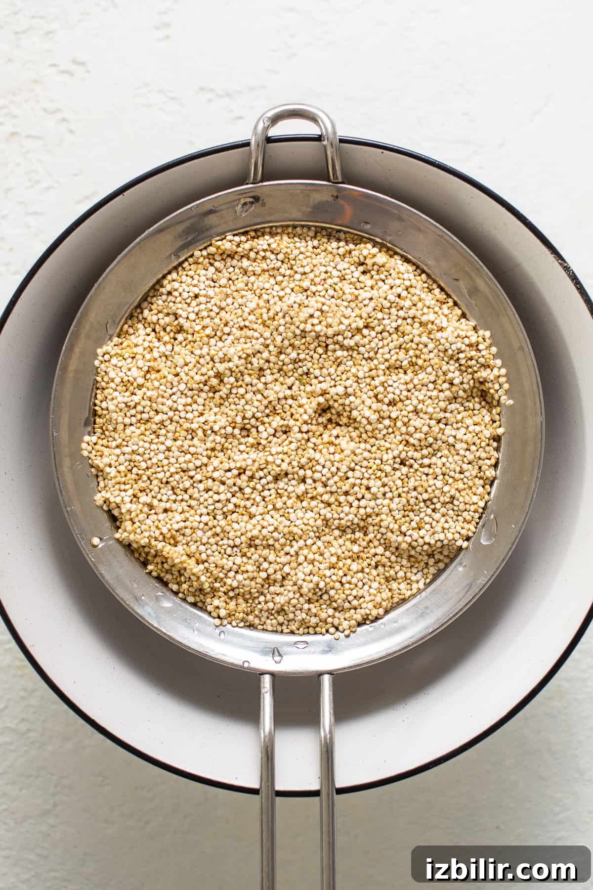 Uncooked quinoa in a sieve. Uncooked quinoa in a sieve.