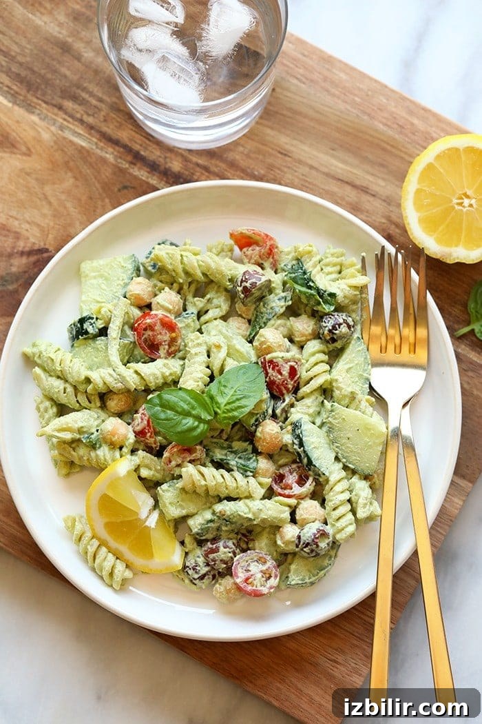 Creamy vegan pasta salad served on a plate. Pasta salad on plate.
