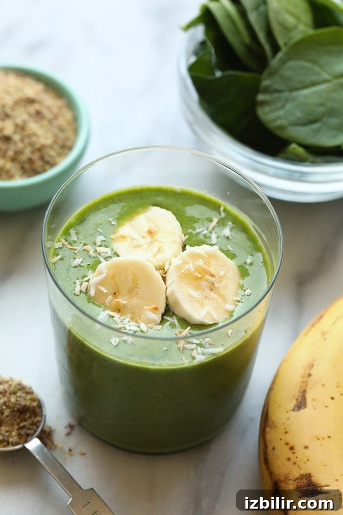 This banana matcha smoothie recipe is packed with nutrients from spinach, flax, and bananas. It is also a great source of energy from the delicious matcha powder! Make it for breakfast this week! Smoothie in a glass