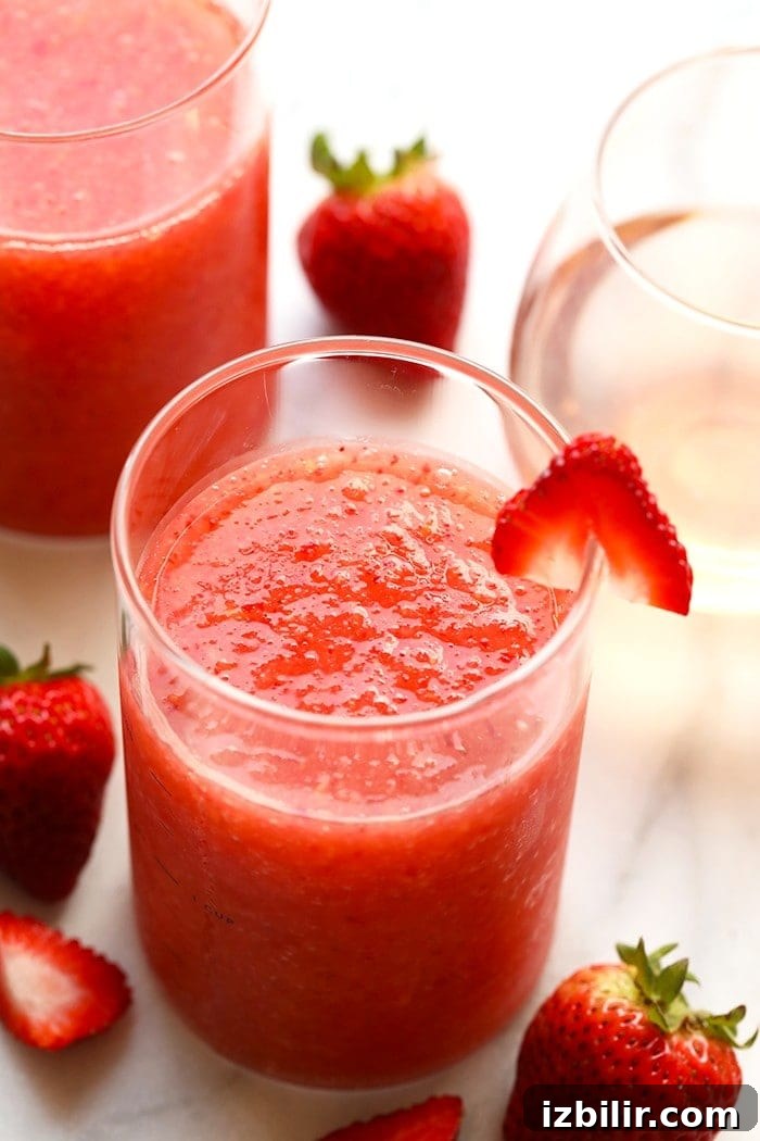 Strawberry Peach Frosé frose in a glass.