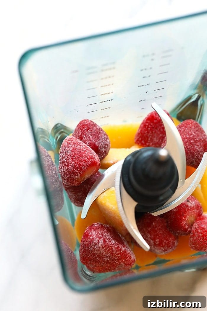 Frozen fruit in a blender frozen fruit in a blender.