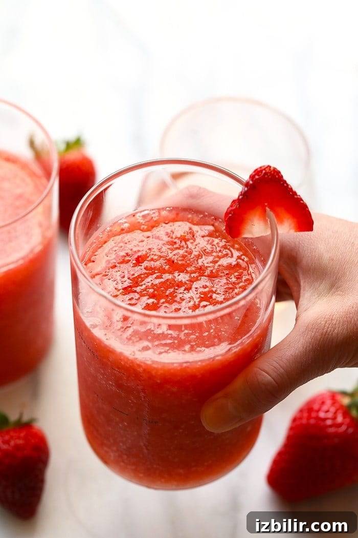 Hand holding frosé hand holding frose.