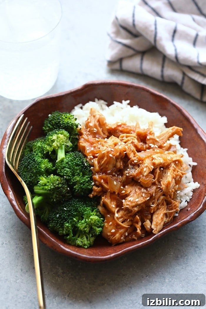 Crockpot Sesame Chicken Crockpot sesame chicken in a bowl with rice and broccoli