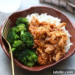 Slow Cooker Sesame Chicken with Honey Garlic Glaze 3 A Crockpot bowl of sesame chicken with broccoli.
