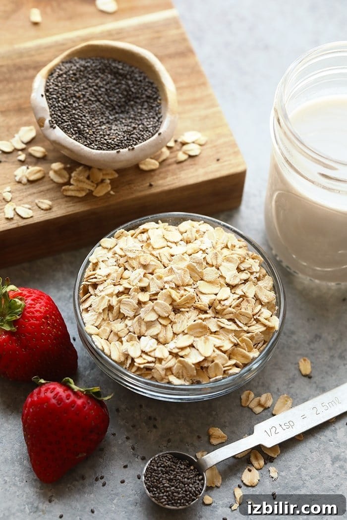 Overnight oats ingredients in bowls ready to be mixed together.