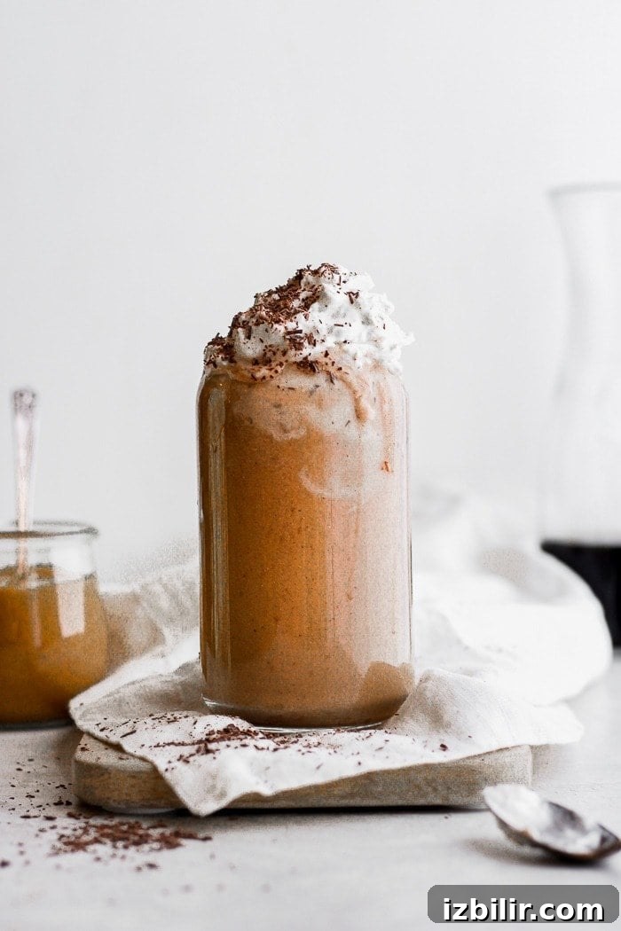 A breakfast smoothie with dairy free whip cream