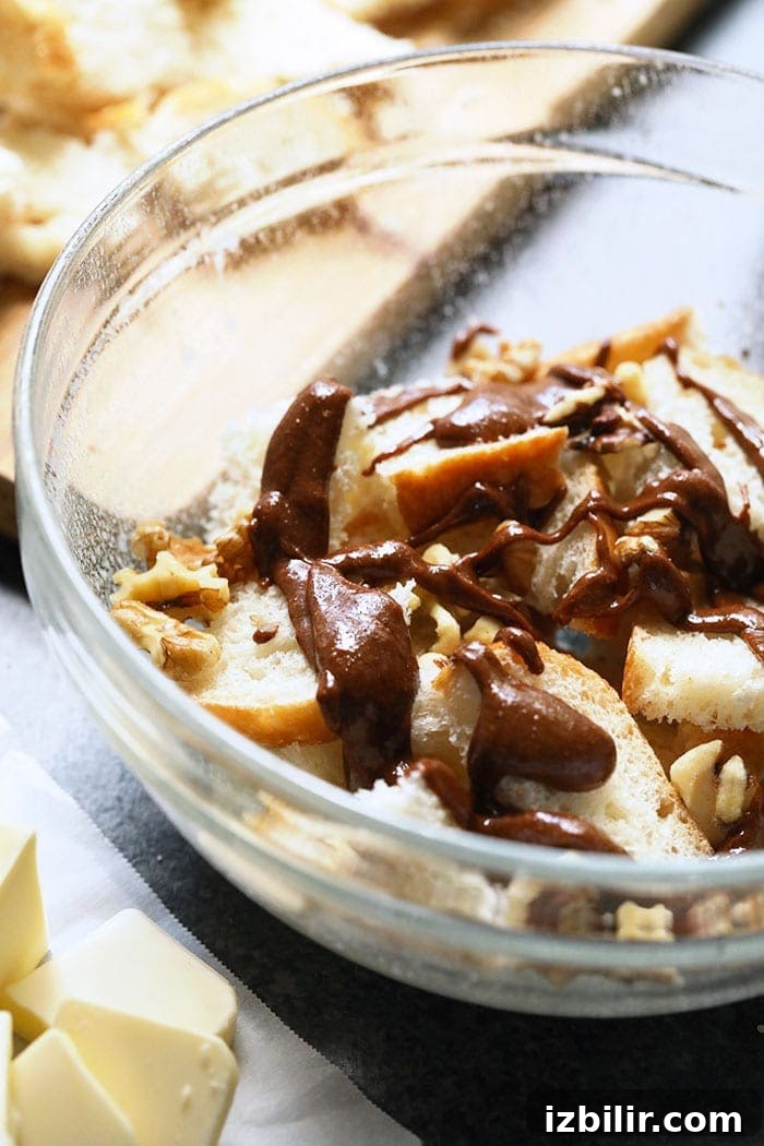 cinnamon roll french toast casserole ingredients in a bowl