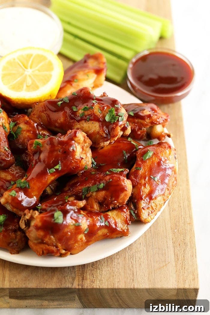 Crockpot chicken wings with sticky BBQ sauce plate of chicken wings with bbq sauce