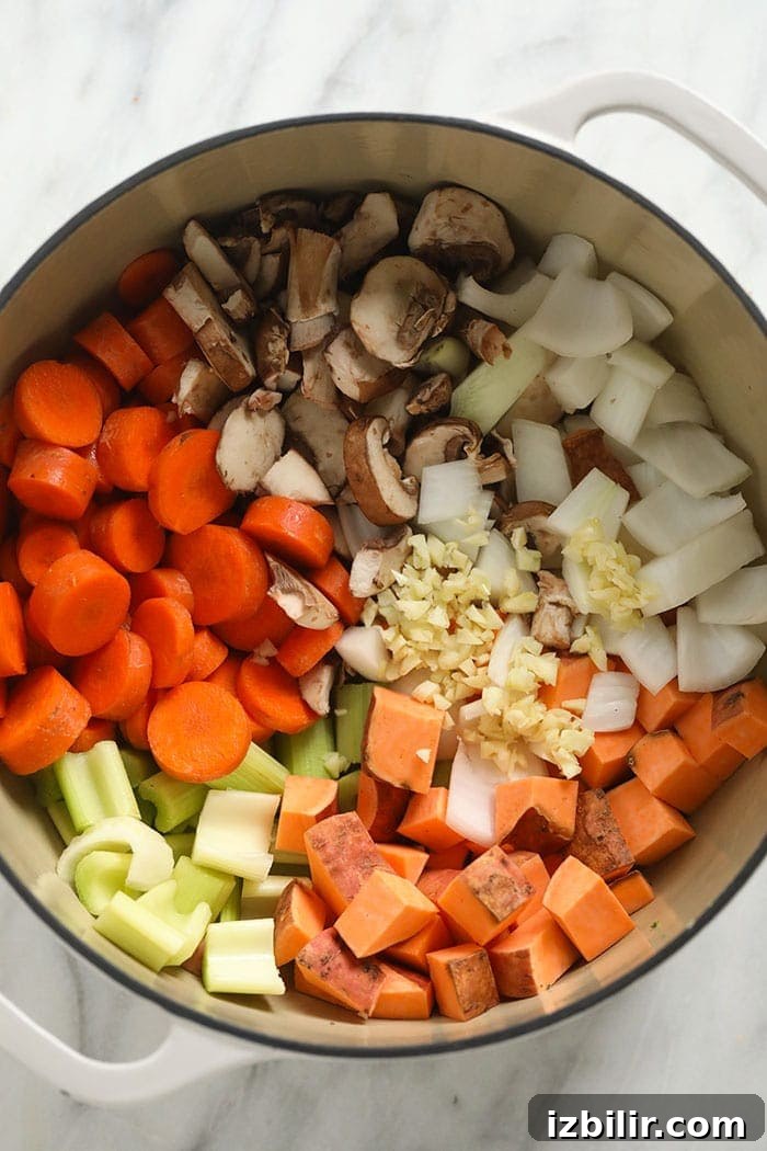 Raw ingredients for sweet potato lentil stew Raw ingredients for the sweet potato lentil stew in a pot.