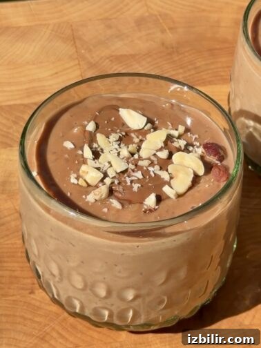 Nutella Arroz con Leche - chocolate rice pudding with a dollop of Nutella and crushed hazelnuts