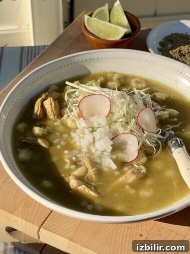 Bowl of Pozole Verde with garnishes