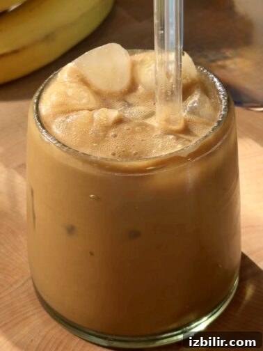 Banana Cream Iced Latte in a glass with ice