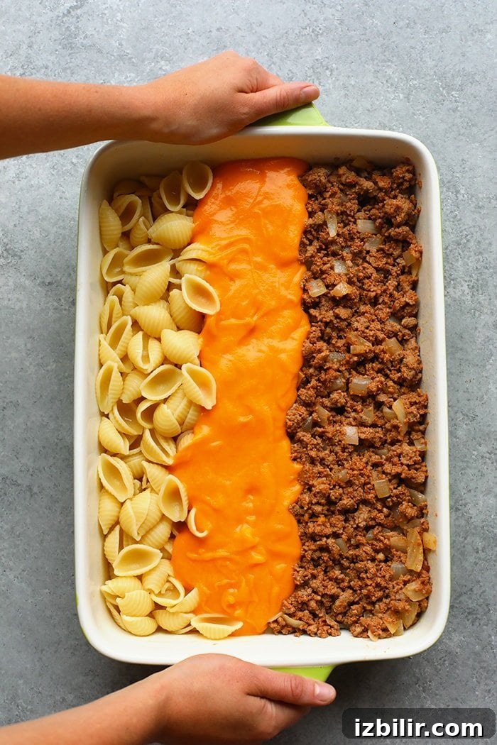 Ingredients arranged Hamburger casserole ingredients in a casserole dish