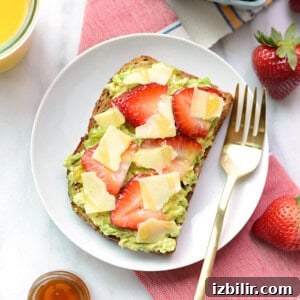 Avocado toast with strawberries and guacamole.