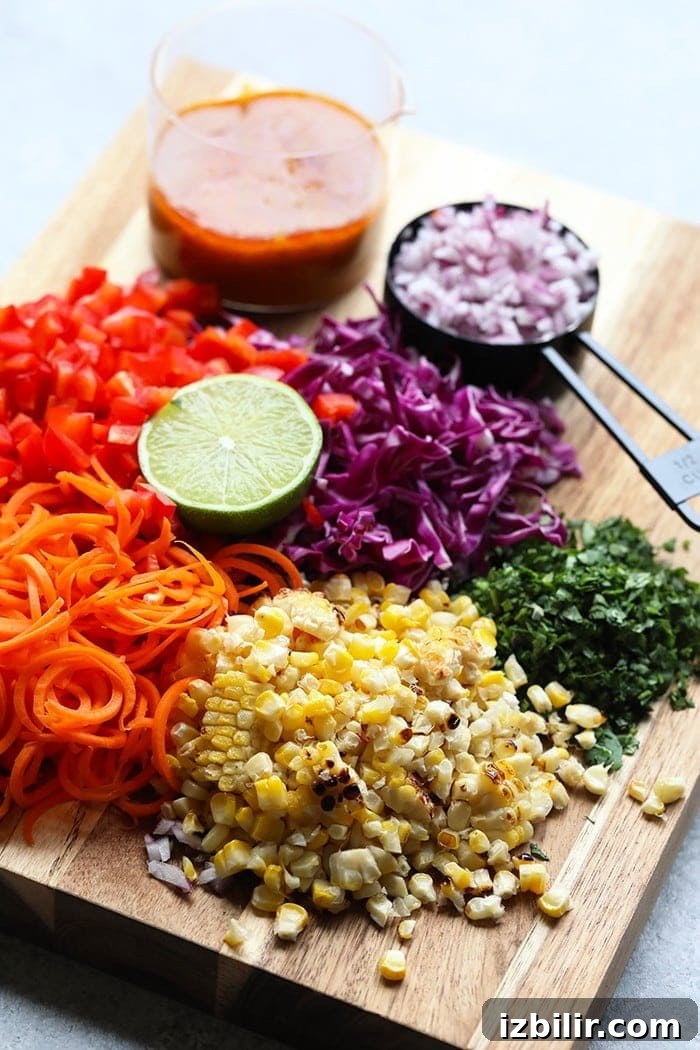 Fresh Summer Corn Salad Recipe with Tomatoes and Basil 2 Ingredients on a cutting board.