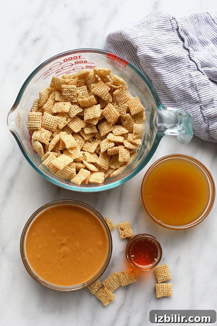 No-Bake Peanut Butter Honey Chex Cereal Balls 3 A bowl of crunchy Chex pieces with honey and peanut butter ingredients.