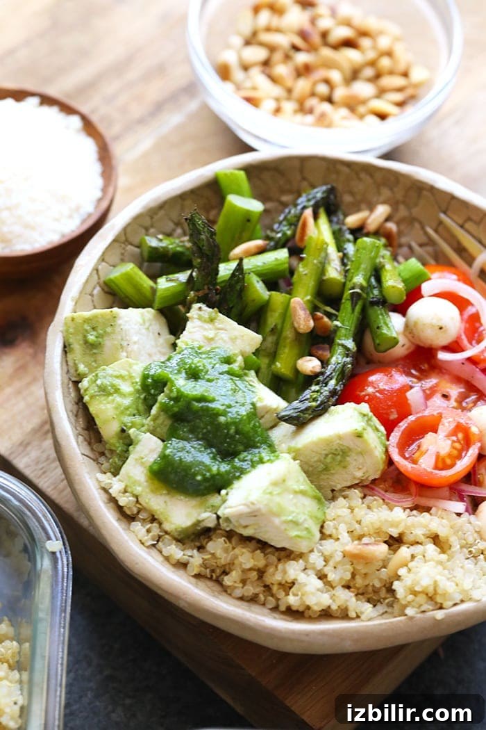 Pesto chicken and sides in a bowl ready to be eaten