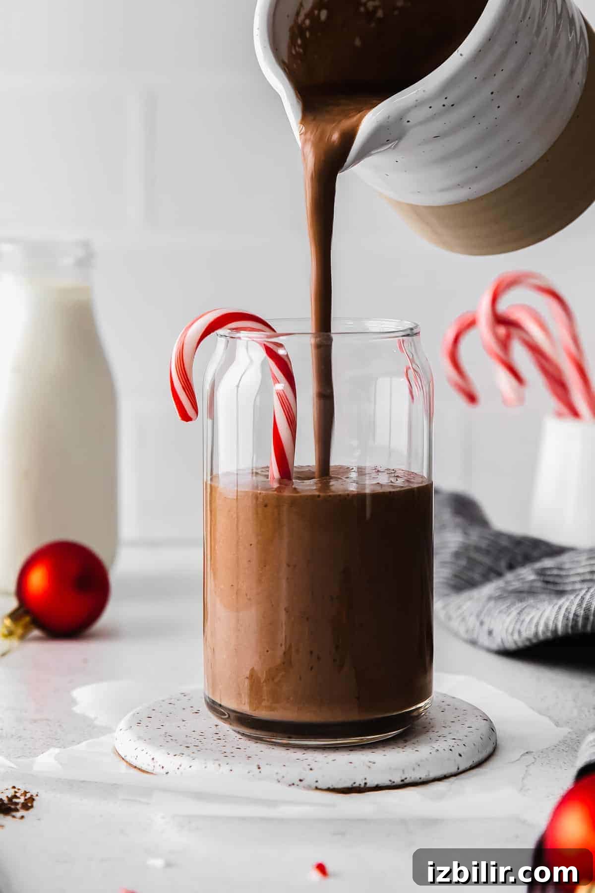 Pouring Chocolate Peppermint Protein Shake pouring smoothie into glass