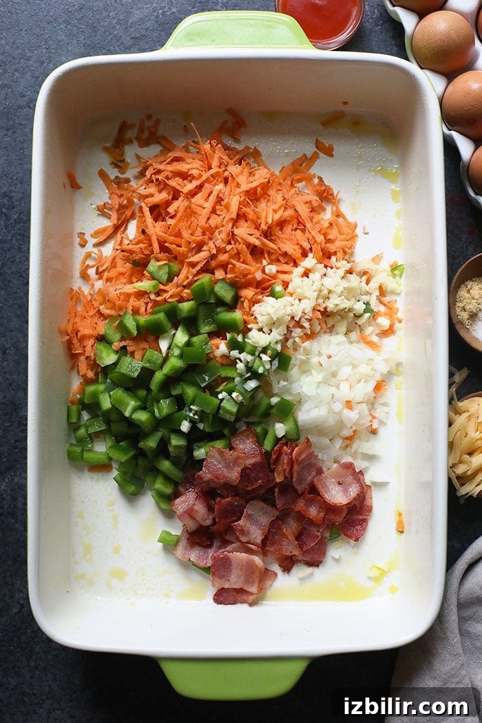 Breakfast casserole ingredients in a casserole dish