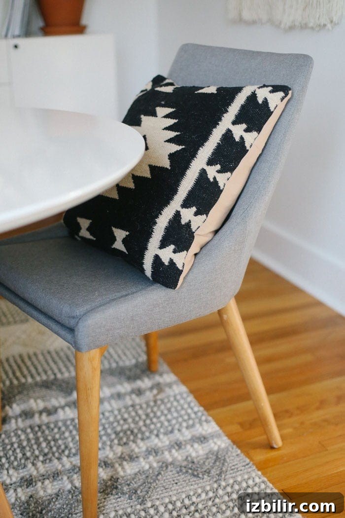 Mid-Century grey chair with aztec pillow