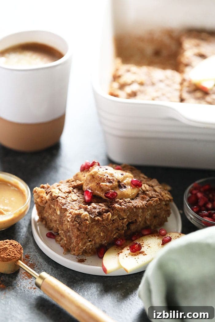 Apple Cinnamon Baked Oatmeal Slice of apple cinnamon baked oatmeal on a plate