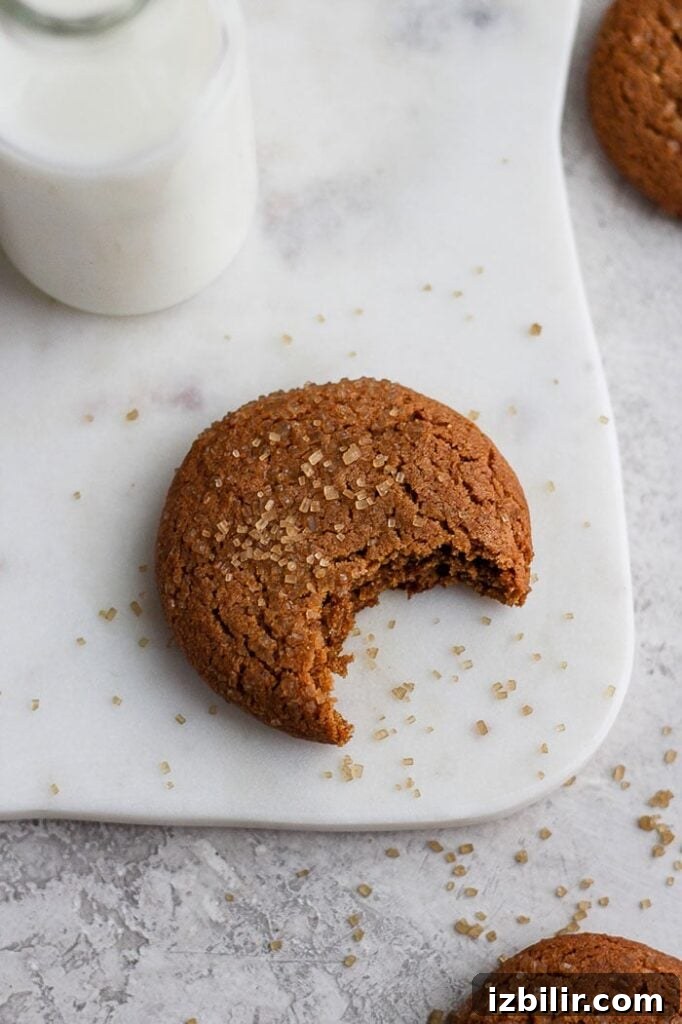 Chewy ginger cookies ginger cookie with bite taken out of it