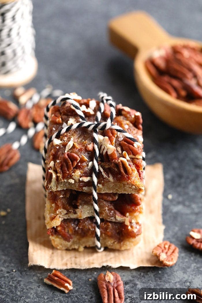 Pecan pie bars ready to serve A stack of pecan pie bars with twine