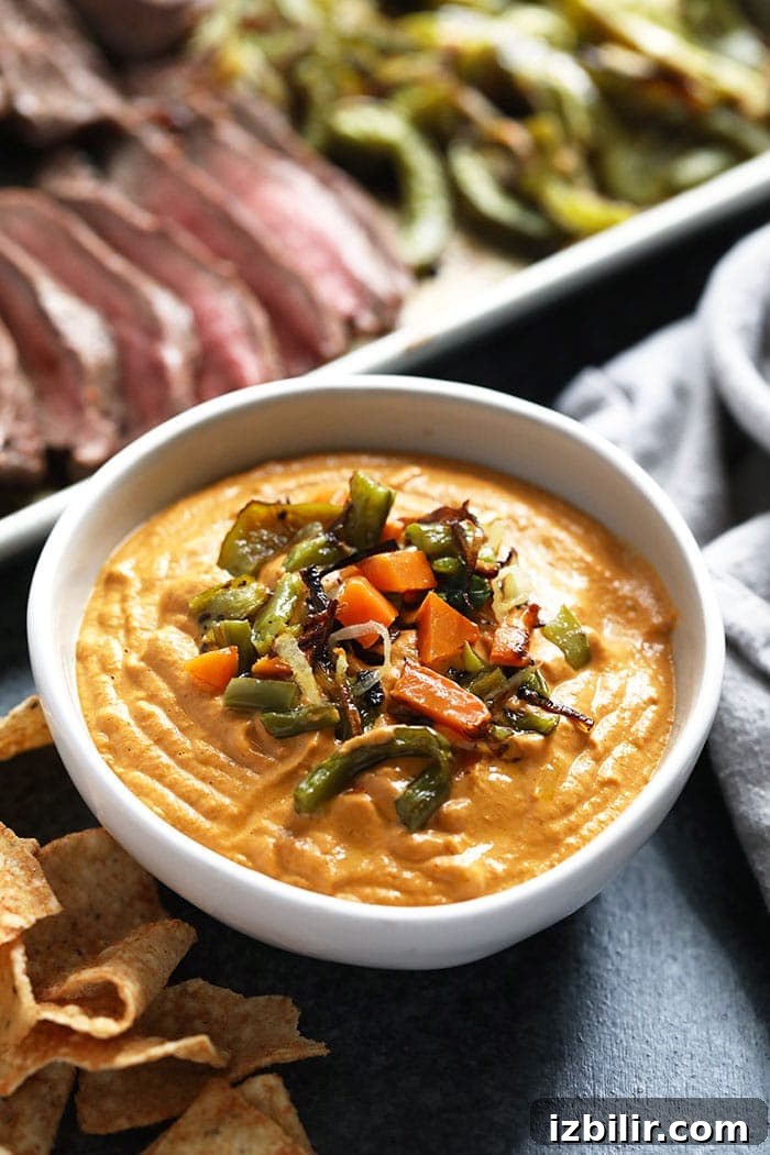 Creamy Vegan Queso Dip Recipe with Cashews 2 Vegan queso in a bowl.