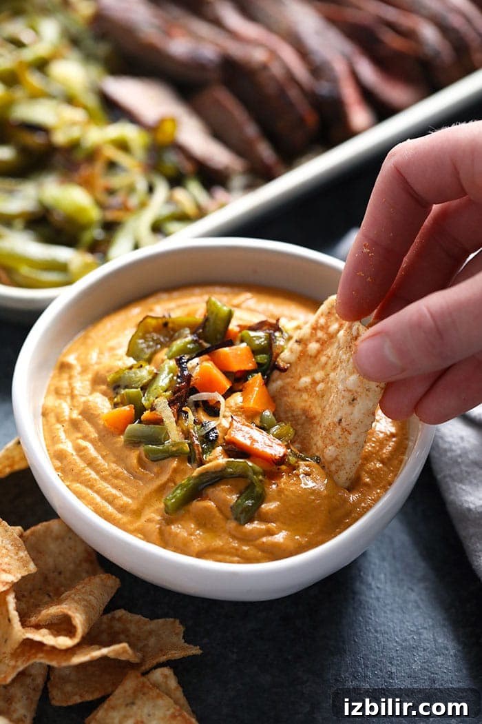 Creamy Vegan Queso Dip Recipe with Cashews 5 Vegan queso in a bowl.