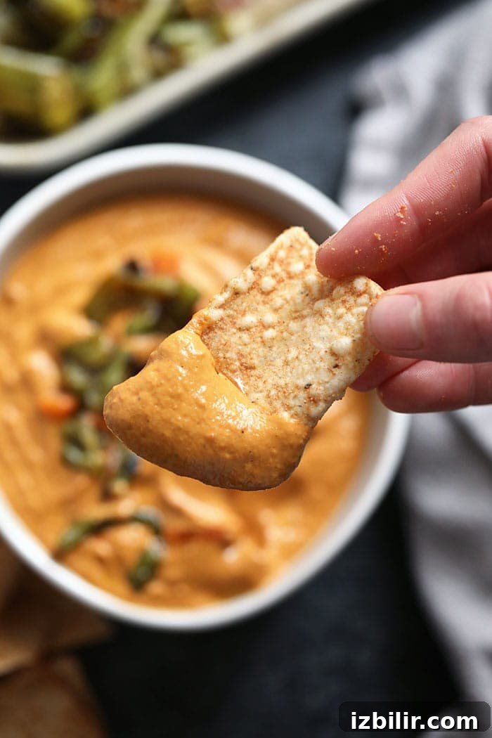 Creamy Vegan Queso Dip Recipe with Cashews 6 Vegan queso on a chip.