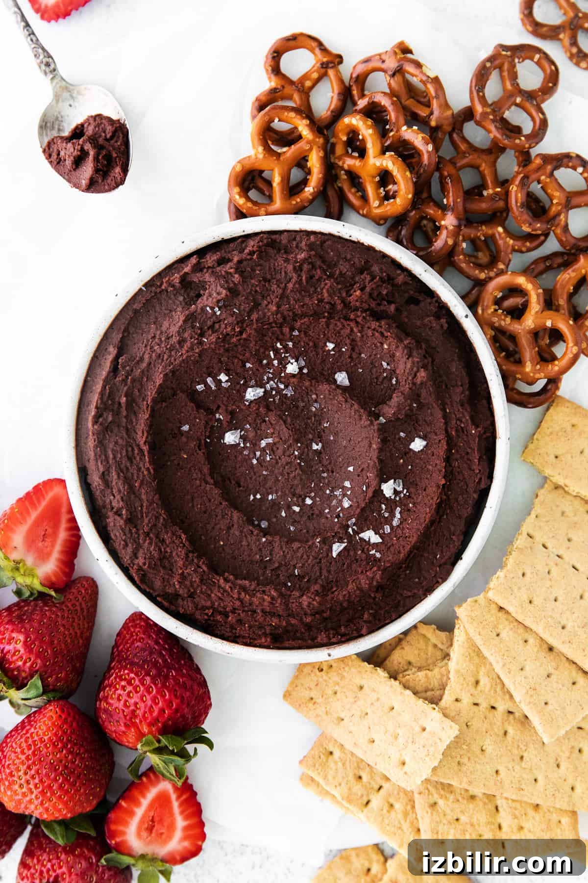 Creamy Chocolate Hummus Dessert Dip Recipe 2 Chocolate hummus in bowl with pretzels, graham crackers, and strawberries