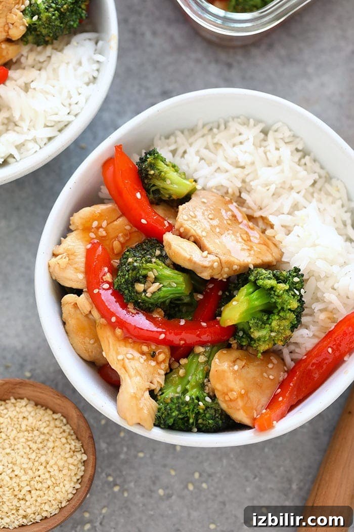 Chicken and broccoli stir fry in a bowl.