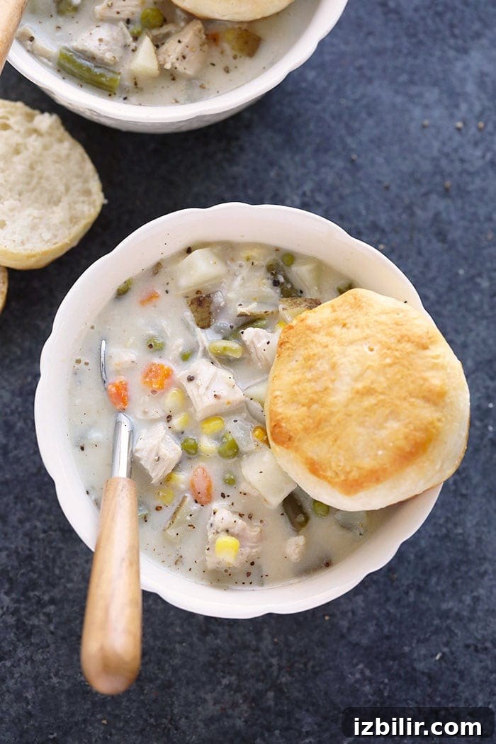 Slow Cooker Chicken Pot Pie Soup Crockpot chicken pot pie soup in a bowl.
