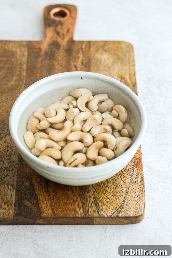 Creamy Vegan Cheese Sauce Recipe 3 soaking cashews in bowl.