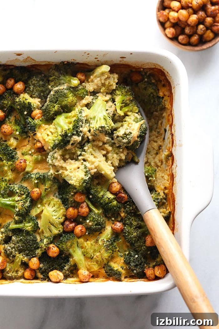 Scooping casserole healthy vegan broccoli and cheese casserole being scooped with a spoon
