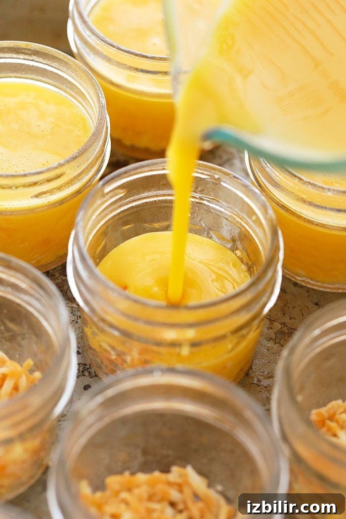 pouring egg mixture into jars